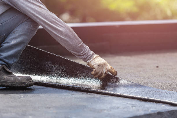 Professional Basement Waterproofing technician working in Turtletown, TN